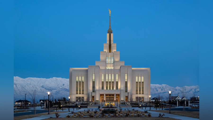 A majestic view of the Saratoga Springs Utah Temple at dusk with Mount Timpanogos in the background...
