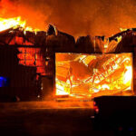 The barn on fire as fire crews arrived. (Weber Fire District)