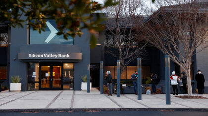 Costumers lineup outside of the Silicon Valley Bank headquarters in Santa Clara