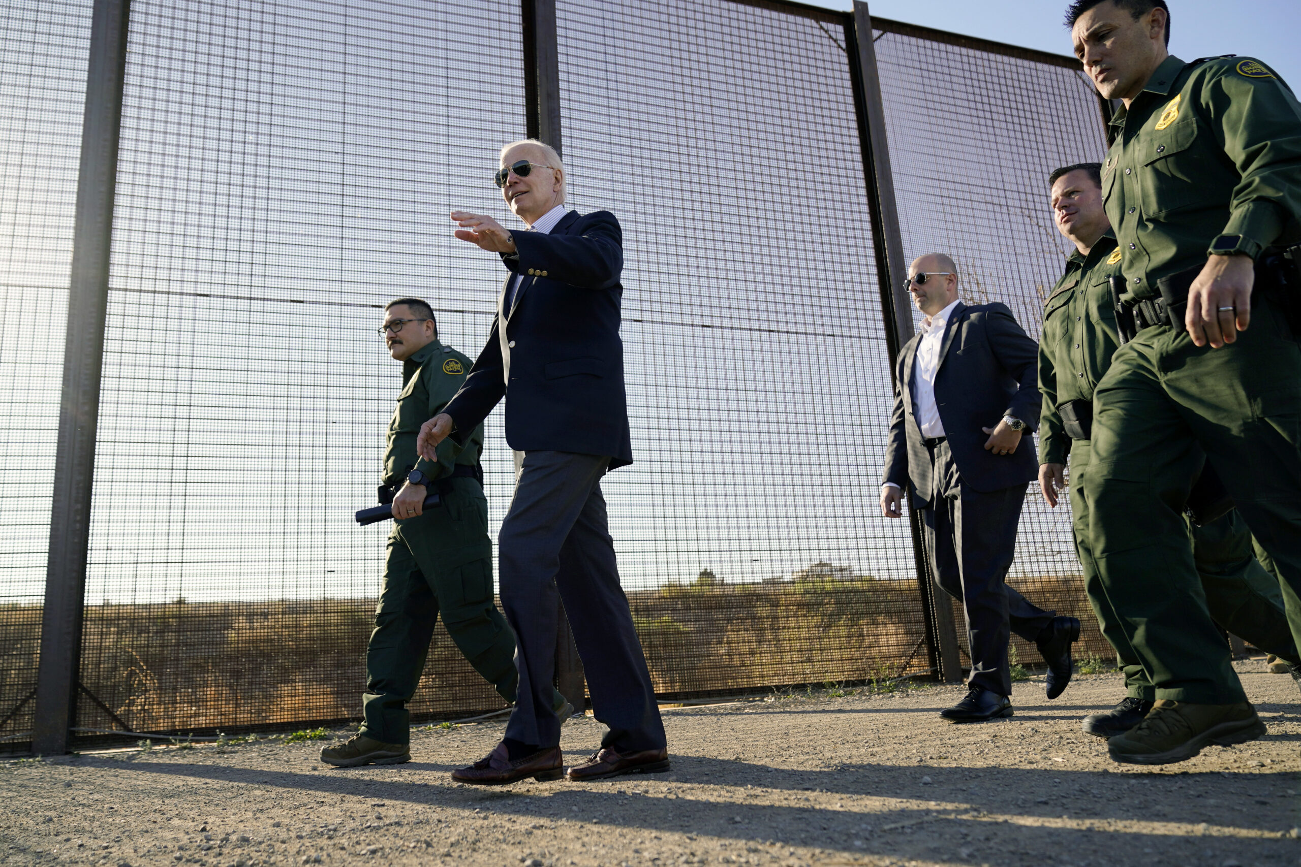 FILE - President Joe Biden walks along a stretch of the U.S.-Mexico border in El Paso Texas, Jan. 8...