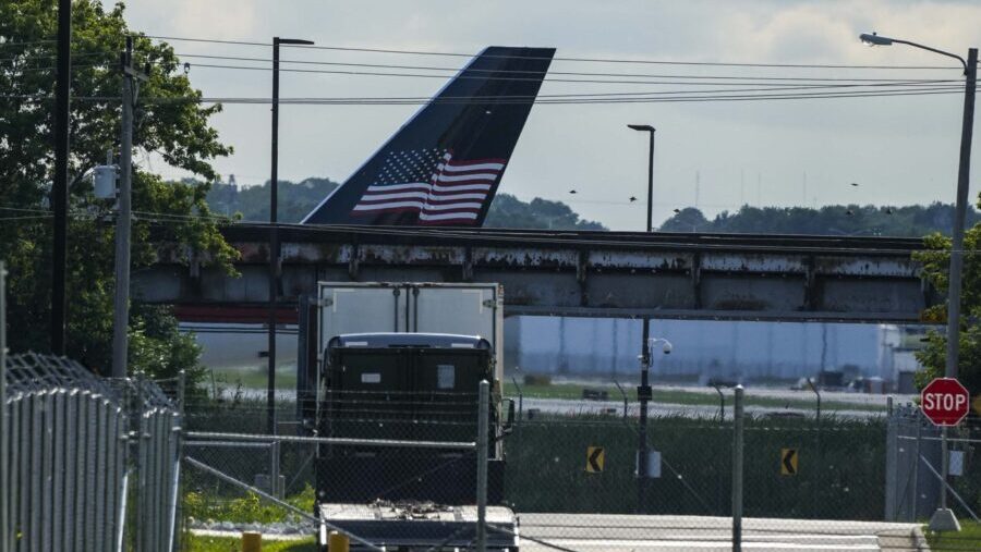 The tail section of former President Trump's airplane is seen on arrival to the Milwaukee Mitchell ...