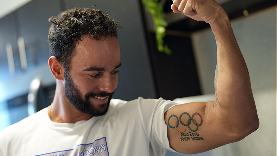 REPLACES INCORRECT CAPTION - Fernando Dayan Jorge displays an Olympic tattoo on his bicep, as he pr...