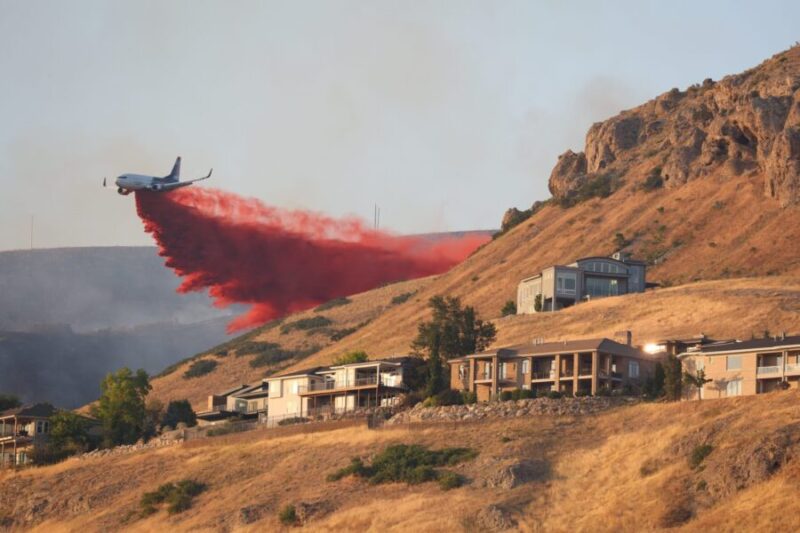 A plane drops fire retardant on the Sandhurst Fire burning above Ensign Peak and north of Salt Lake...